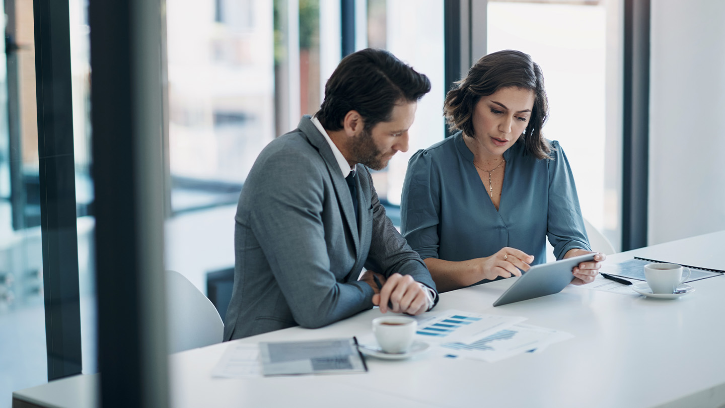 2 people in a meeting room