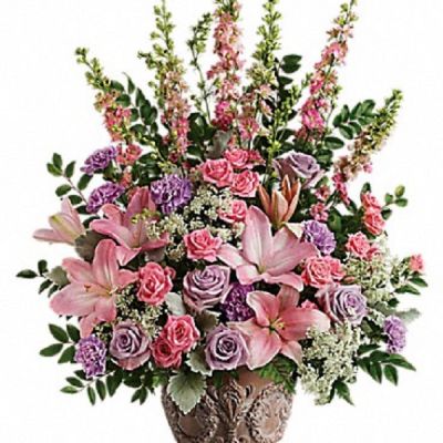 <div class="m-pdp-tabs-description">
<div id="mark-1" class="m-pdp-tabs-marketing-description">A touching tribute to a beloved woman, this beautiful, soft pink and lavender arrangement is presented in a large antiqued pot for an elegant touch.</div>
</div>
<p id="arrngDescp">This soft pink arrangement features lavender roses, pink spray roses, pink asiatic lilies, lavender carnations, pink larkspur, queen anne's lace, huckleberry, dusty miller, and leatherleaf fern.</p>